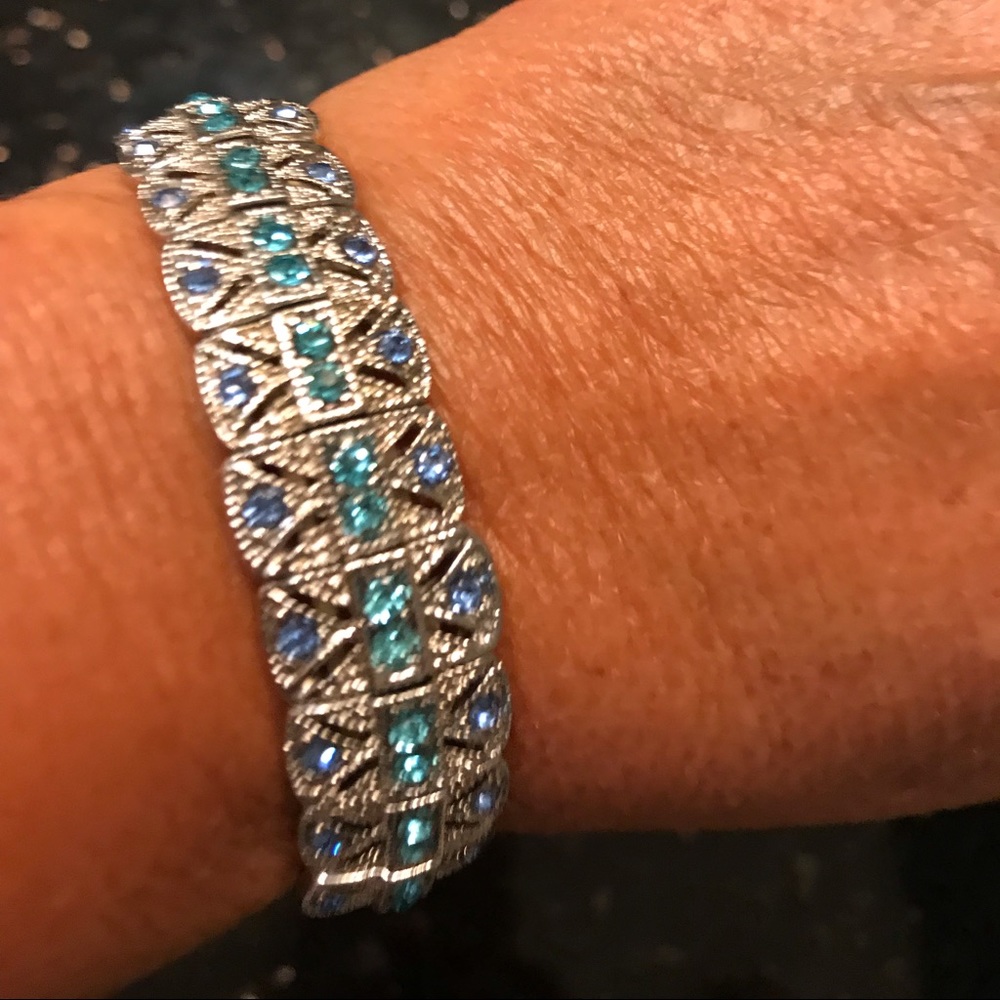 Silver tone bracelet with crystals
